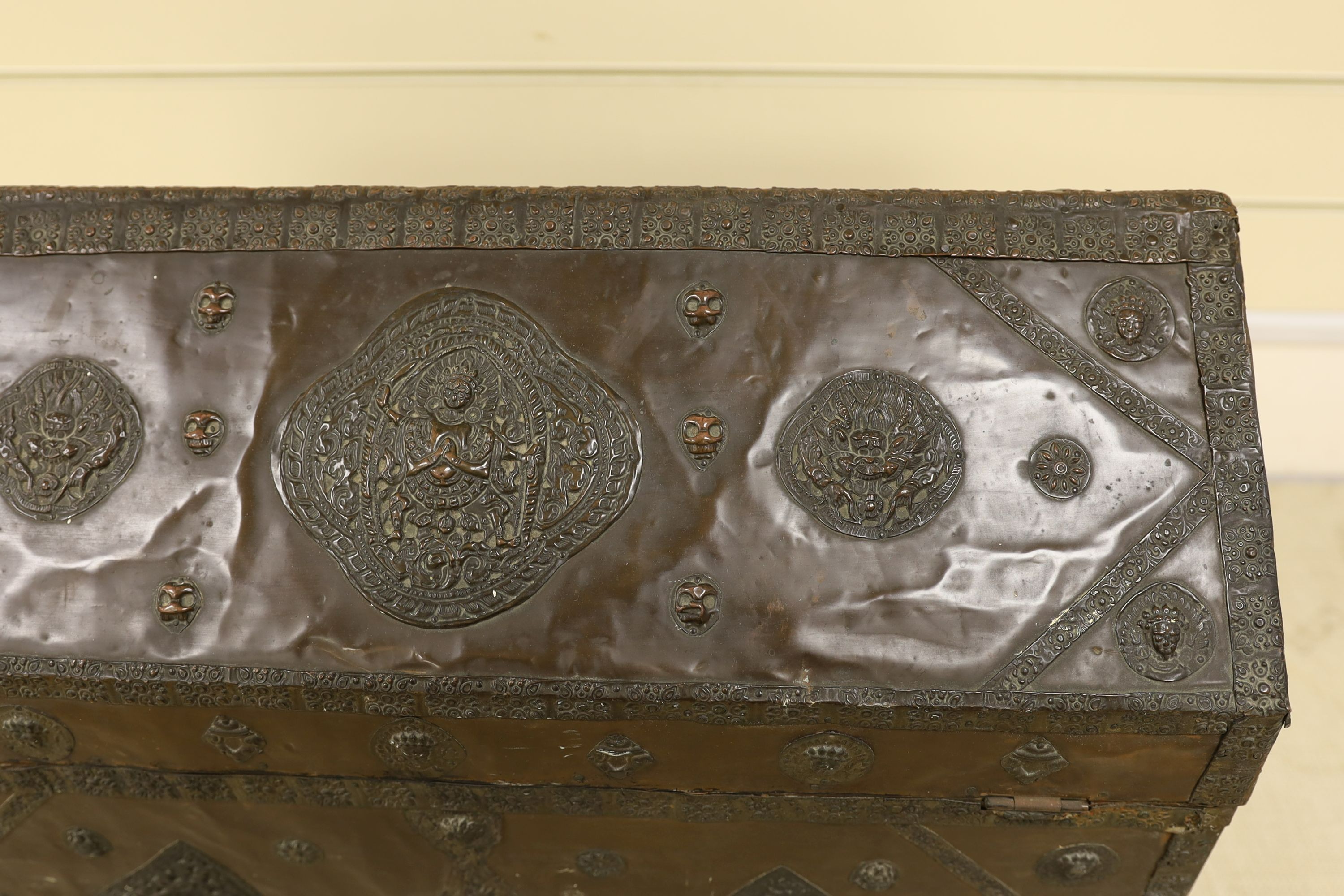 A Tibetan copper repousse-work casket, 20th century, 65cm wide, 49.5cm